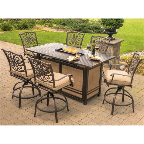 Firepit tables can burn wood, natural gas, or propane gas for fuel. Hanover Traditions 7-Piece High-Dining Set in Tan with ...