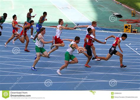 The 4 × 100 metres relay or sprint relay is an athletics track event run in lanes over one lap of the track with four runners completing 100 metres each. Athletes On The 4 X 100 Meters Relay Race Editorial Stock ...