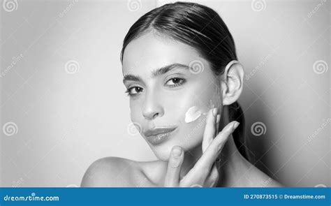 Beautiful Woman Spreading Cream On Her Face Skin Cream Concept Facial