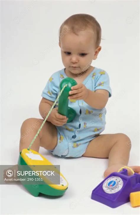 Baby Boy Playing With Toys Superstock