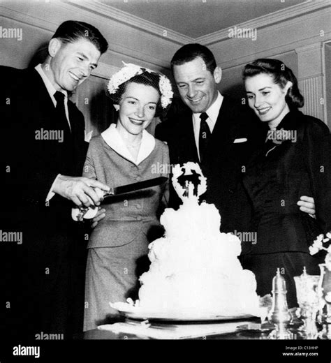 Ronald Reagan Nancy Davis Reagan Cutting Their Wedding Cake As Stock