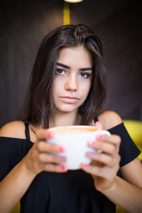 Charming Girl Having Great Time Drinking Cup Of Cappuccino Latte