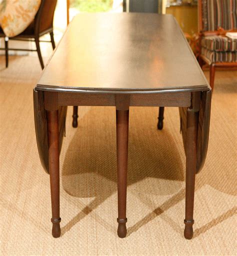 A dining table is useful in every home, whether you're having family dinner time every night or you use it a few times a year. Large Double Drop Leaf Dining Table For Sale at 1stdibs