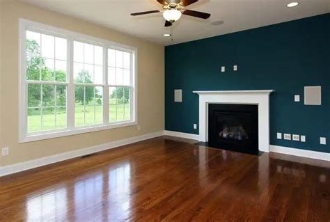 Dark Bluegreen Accent Wall And Cream Accent Walls In Living Room