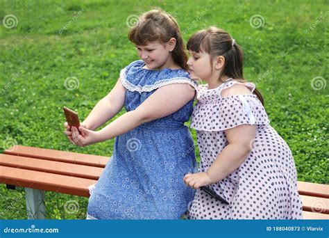Two Chubby Girls Take Selfie On A Smartphone Stock Image Image Of