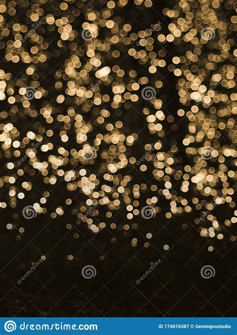 Background Of Abstract Glitter Lights Gold And Black De Focused Stock