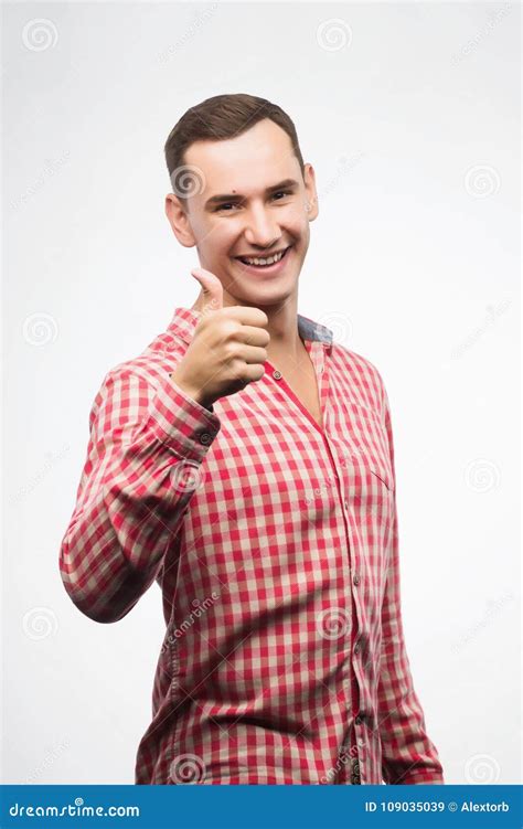 Young Man Wearing Checkered Red Shirt Shows Sign Thumbs Up Stock Image