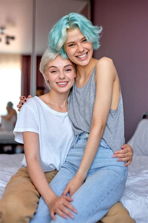 Portrait Of Happy Lesbian Couple Having Fun In Bright Cozy Room Together Lgbt Concept Stock