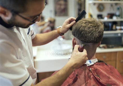 Barber Shaving Head Of A Customer In Barbershop — Men Expertise