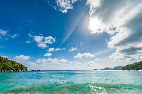 Indian Ocean Water And Beach In Seychelles Mahe Island Moutain And
