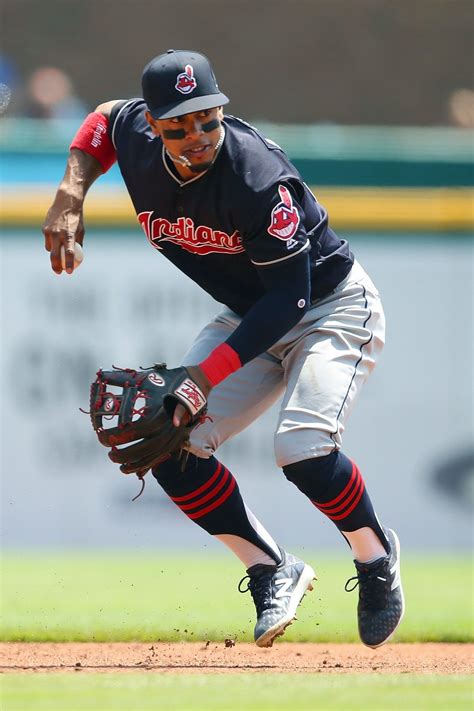 Get his glove view player. Cleveland Indians Francisco Lindor sets to throw to first ...