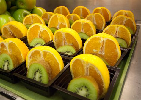 Filekiwi And Orange Fruit Cups For Students In The National School
