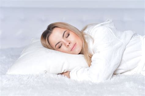 Blond Young Woman Sleeping On A Bed At Home Hoodoo Wallpaper