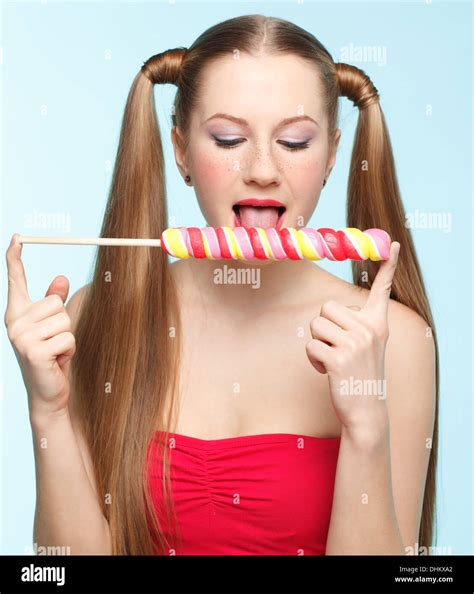 Licking Lollipop Hi Res Stock Photography And Images Alamy