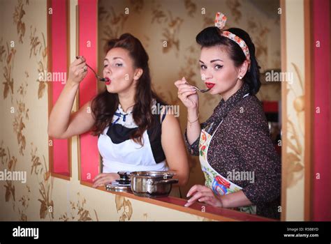 Two Women In The Kitchen Prepare And Taste Food Retro Style Household