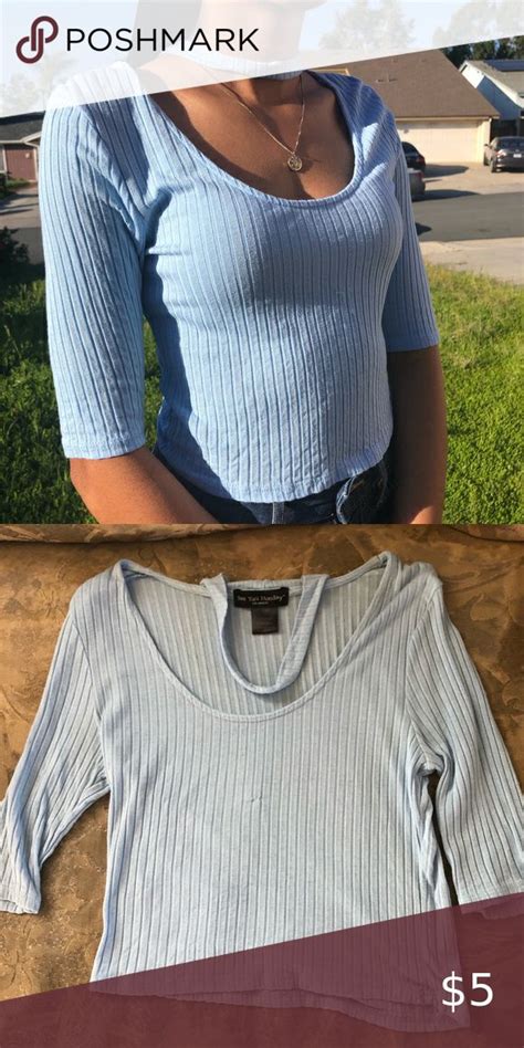 Women's light blue top.