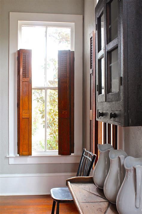 The white interior california shutters wooden plantation shutter blind window wooden louver shutters. Curious Details - shutters | Indoor shutters, Wooden ...