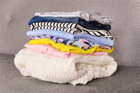 Bunch Of Different Colorful Clothing Items Folded In Stack Stock Photo