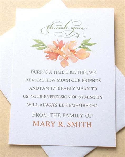 A Thank Card With An Orange Flower On The Front And Bottom Which Reads