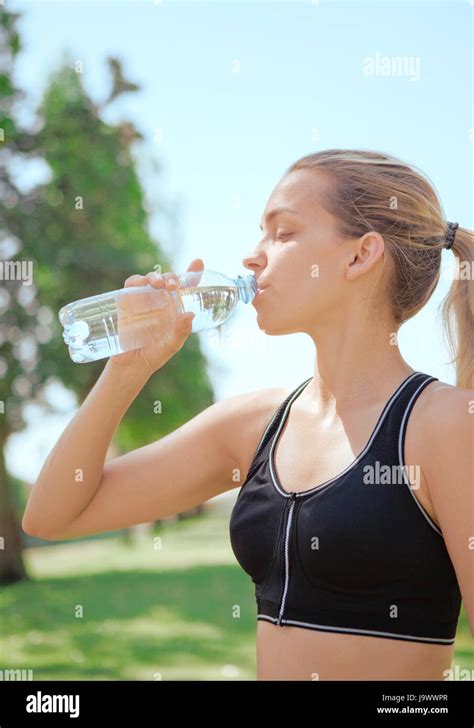 Woman Drink Water Bottle Of Water Running Stock Photo Alamy
