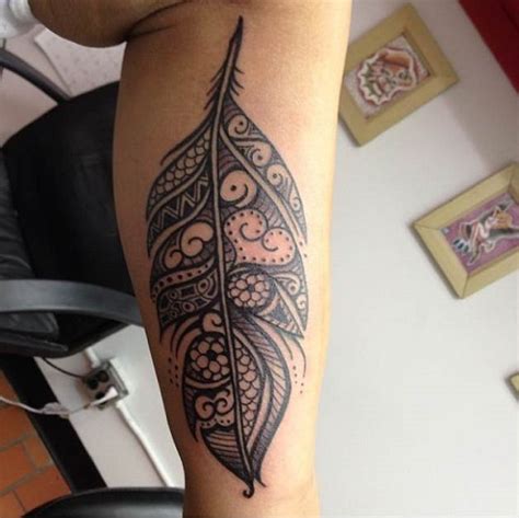 13 Beautiful Tribal Feather Tattoos
