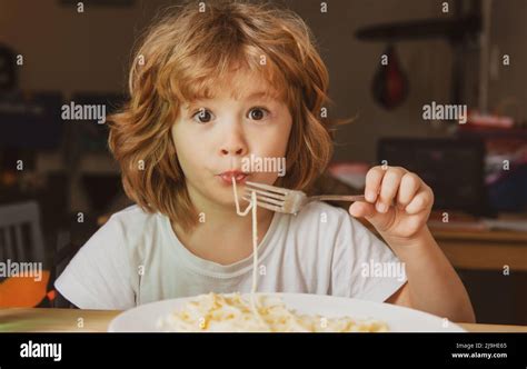 Funny Child Eating Pasta Spaghetti Kids Face Little Boy Portrait