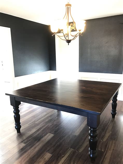 Deep grey finish on top and ivory painted base. A Square Baluster Turned Leg Dining Table from James+James will add a modern farmhouse sty ...