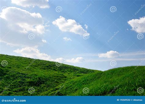 Grassy Hills Under Blue Skies Stock Photo Image Of Scene Field 19269532