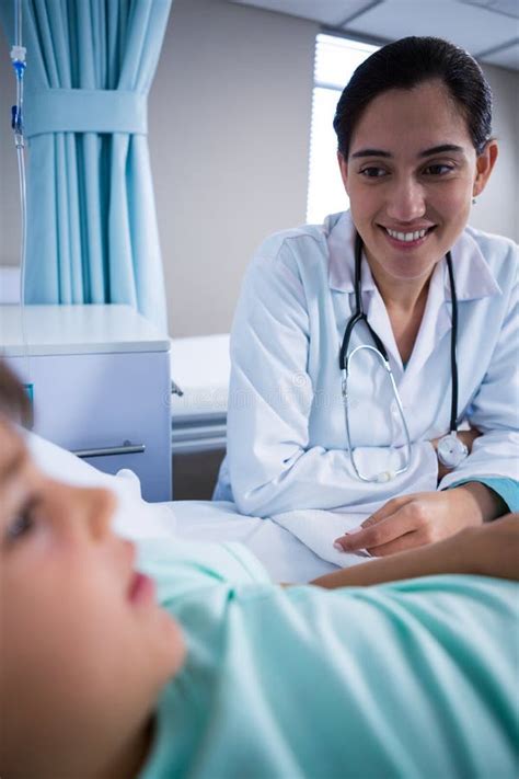 Smiling Doctor Interacting With Patient In Ward Stock Image Image Of