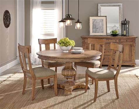 Dining room table sets are a fast way to make a dining room look perfectly pulled together. The Wellington Hall Round Table Dining Room Collection ...