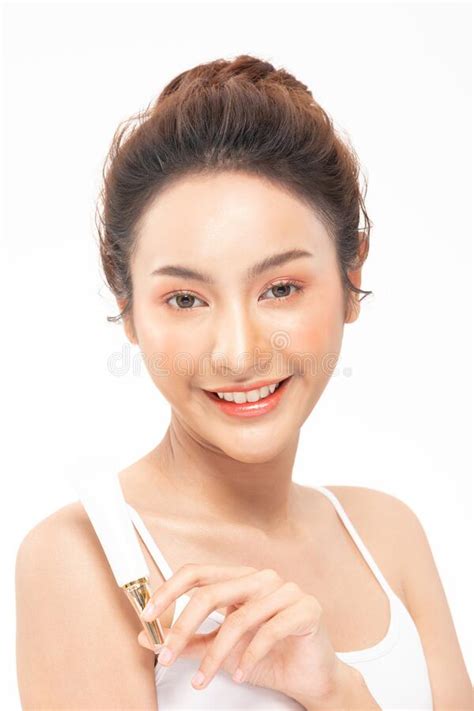 Beautiful Young Asian Woman Holding Luxury White Clean Tube Smile
