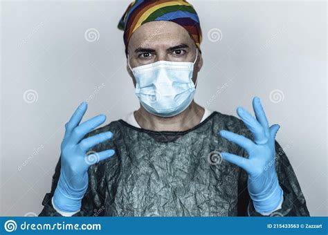 Surgeon Doctor Wearing Protective Mask Blue Gloves And Rainbow