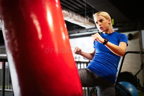 Boxing Training Woman With Punching Kicking Bag In Gym Stock Photo