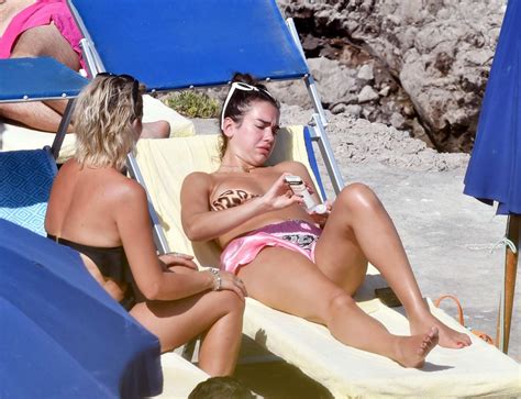 Dua Lipa In A Bikini Top Sunbathing While On Her Summer Holiday In