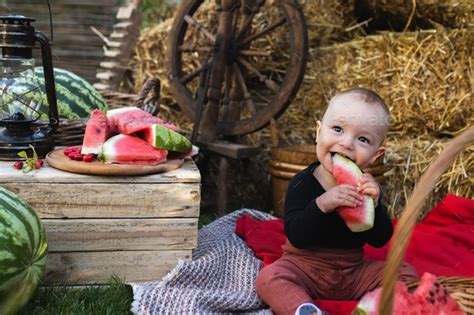 Little Funny Boy Eating Watermelon A Funny And Emotional Child Is