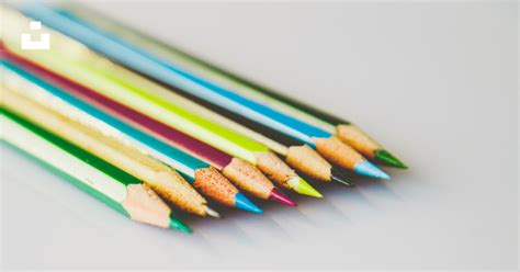 Selective Focus Photography Of Assorted Color Pencils On White Surface