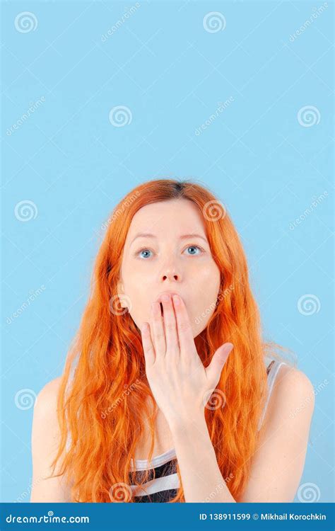 redhead girl covers her mouth with her hand surprise and shock stock image image of mouth