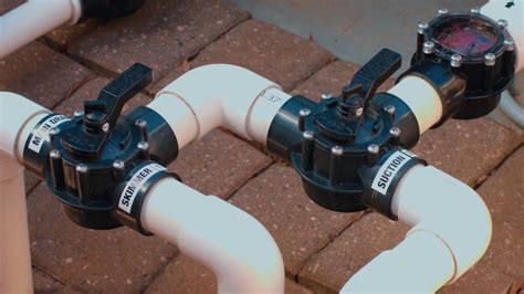 If it has motorized valves the stop positions have to be adjusted so that the water coming back is equal to what it drains to stop the spill. How to: Pool Valves - YouTube