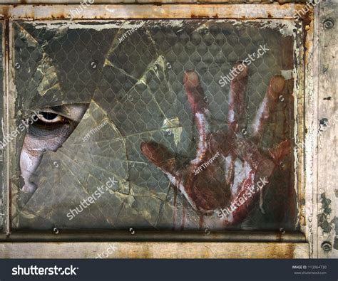 Creepy Eye Zombie Looking Through Broken Glass Window With Bloody Hand