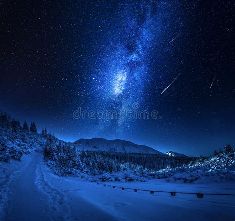 Milky Way And Snowy Footpath At Night In Tatra Mountains Stock Photo