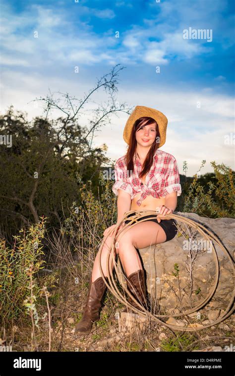 Portrait Of Young Woman With Rope In Casual Cowgirl Outfit Wearing