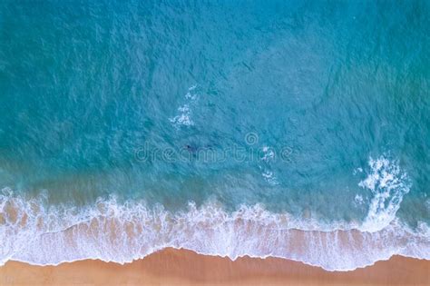 Aerial View Sandy Beach And Waves Beautiful Tropical Sea In The Morning