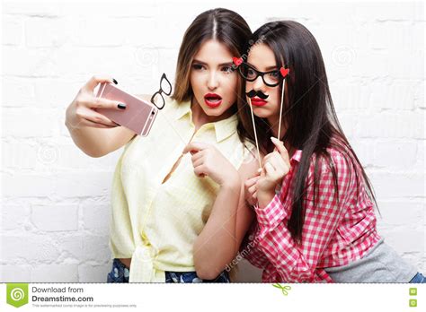 Two Young Women With Party Glasses Taking Selfie Stock Image Image Of