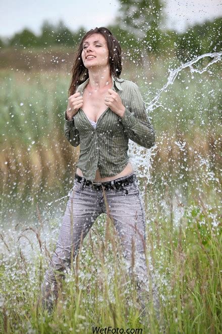 Pretty Woman Get Wet In Light Jeans Shirt And Shoes With Heels Wetfoto