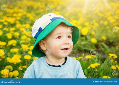 Little Boy In Hat Standing On The Field Stock Photo Image Of Carefree