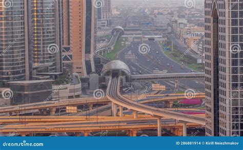 Busy Sheikh Zayed Road Aerial Night To Day Timelapse Metro Railway And