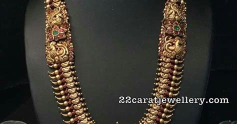 Antique Set With Kundan Peacock Lakshmi Pendant Jewellery Designs