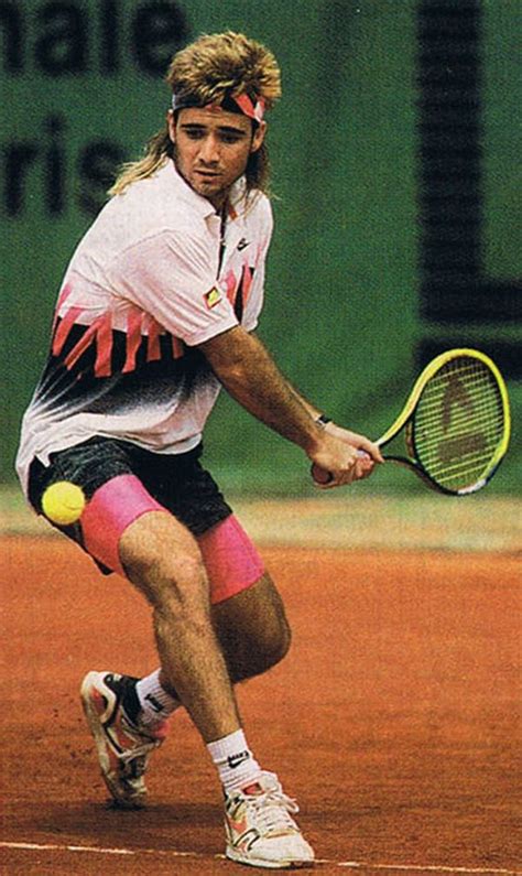 A Male Tennis Player In Action On The Court