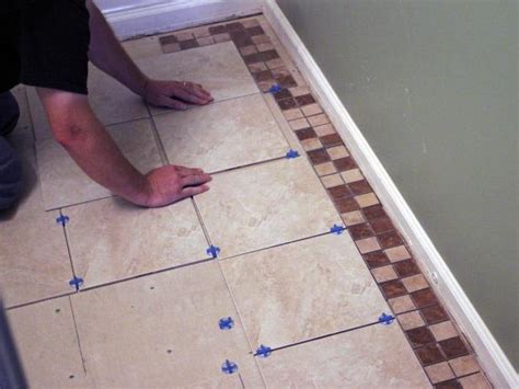 A tile cutter, spacers and tiles, a tape measure, spreader, a pencil, grout, level, sponge, goggles and some gauntlets. How to Install Bathroom Floor Tile | how-tos | DIY