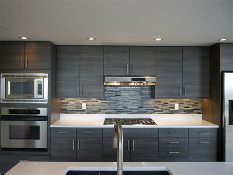 Paint the feet to match the cabinetry for the. Seattle Condo Modern Kitchen Reface